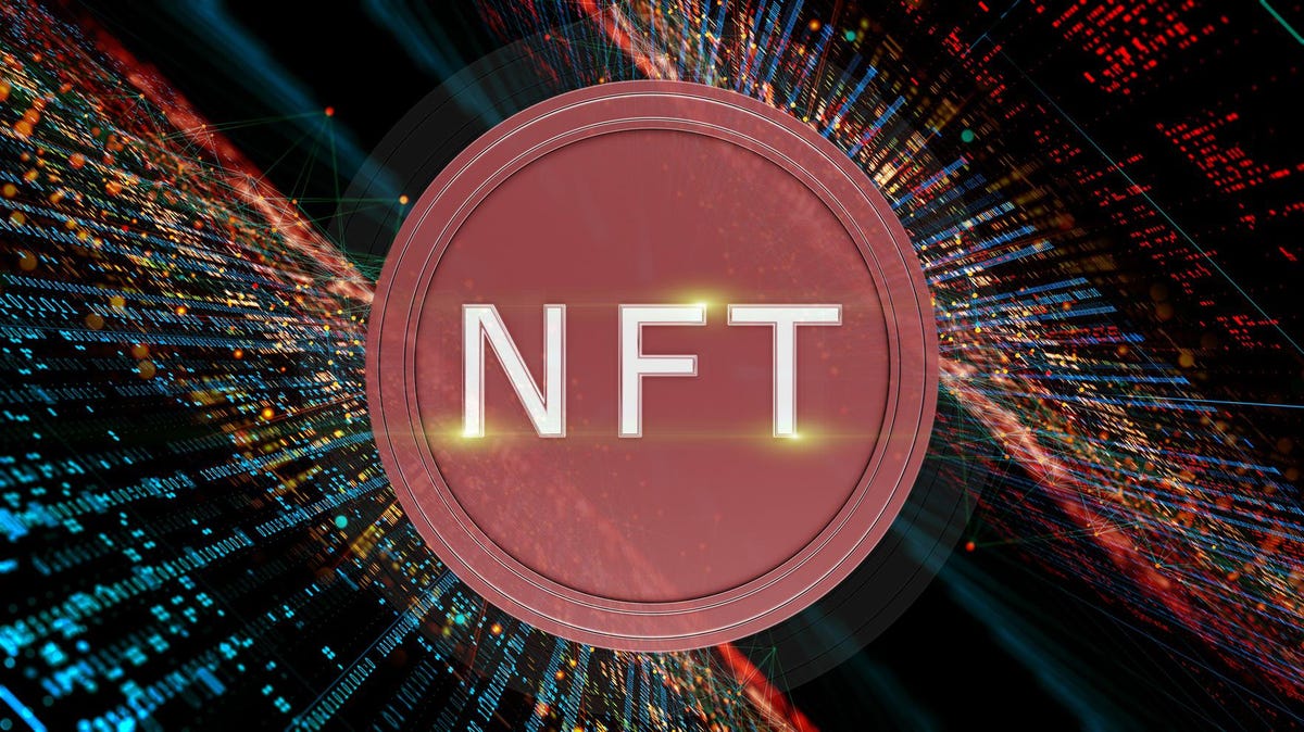 Picture of a red circle with NFT written on it surrounded by walls of jpeg NFTs on both sides