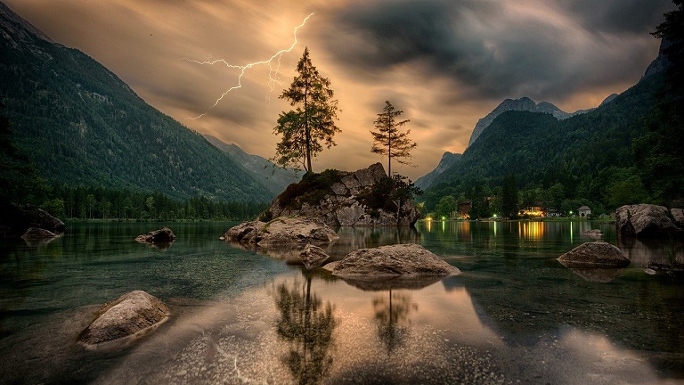 Lightning, a lake under a thunderstorm