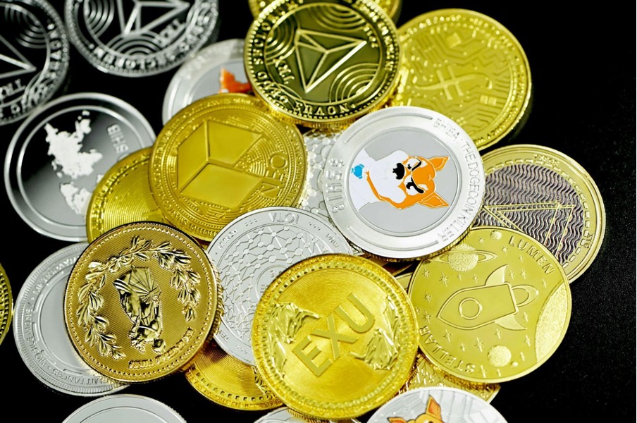  lots of sample crypto coins with dogecoin prominent